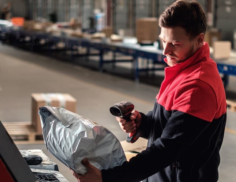 warehouse worker using parcel shipping software