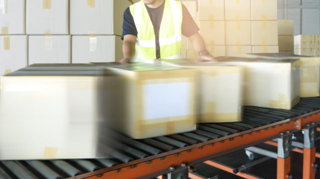 Boxes moving on conveyor
